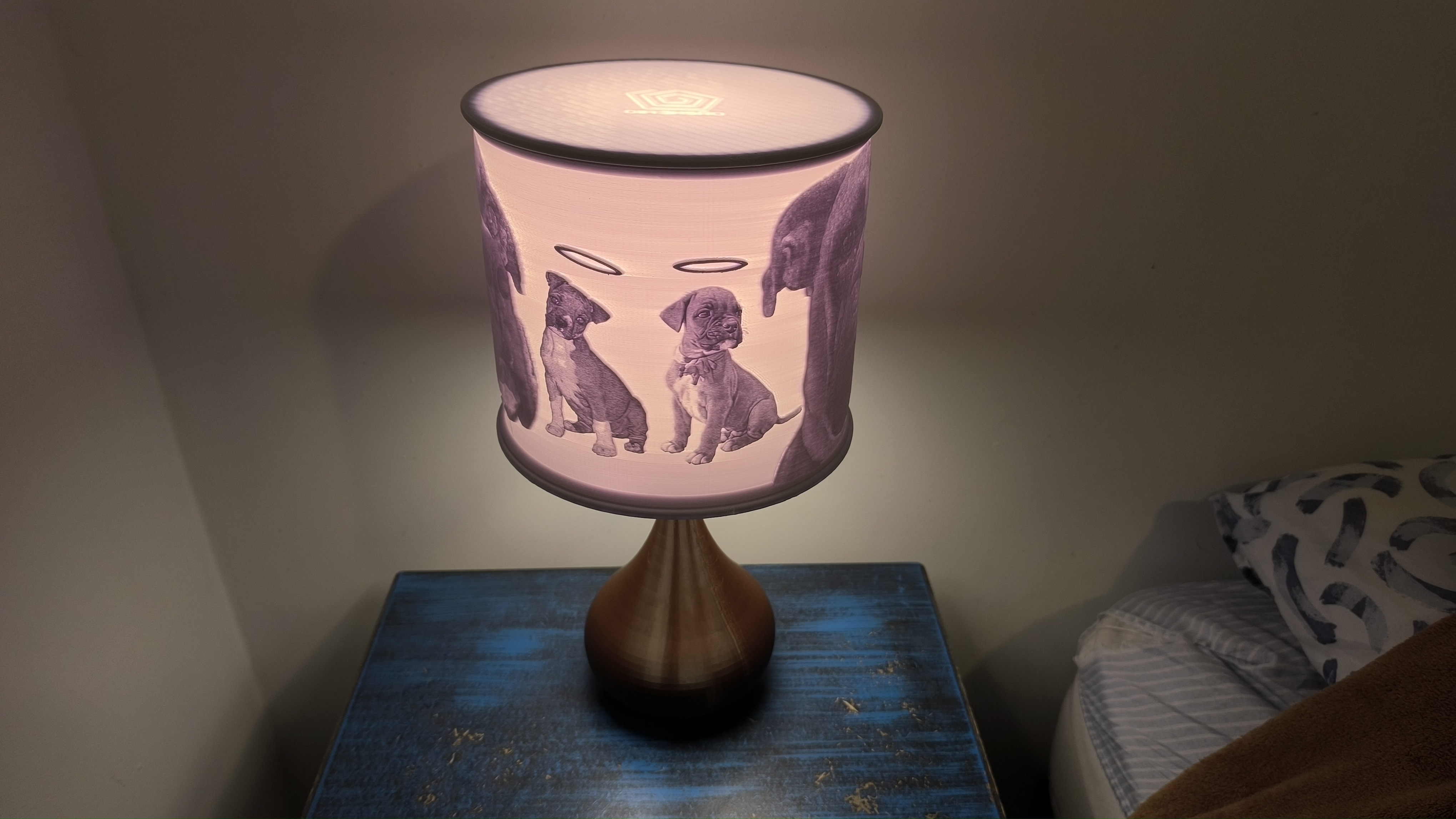 A litophane with a picture etched into it, glowing warmly.